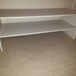 Several white wood shoe rack, bookshelf, closet organizer, plant stands
