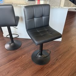 2 Adjustable/swivel Black Bar Stools 