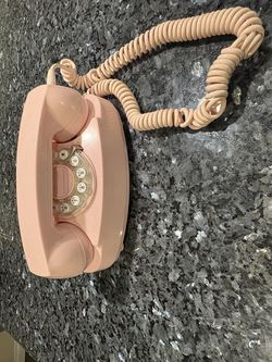 Pink Crosley rotary phone