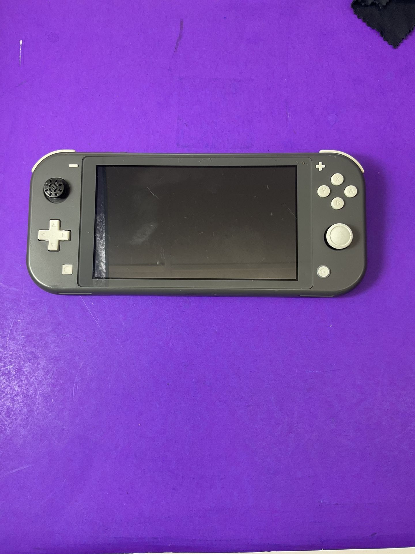 Gray Nintendo Switch Lite – Fully Working (Left Joystick Pad Missing)
