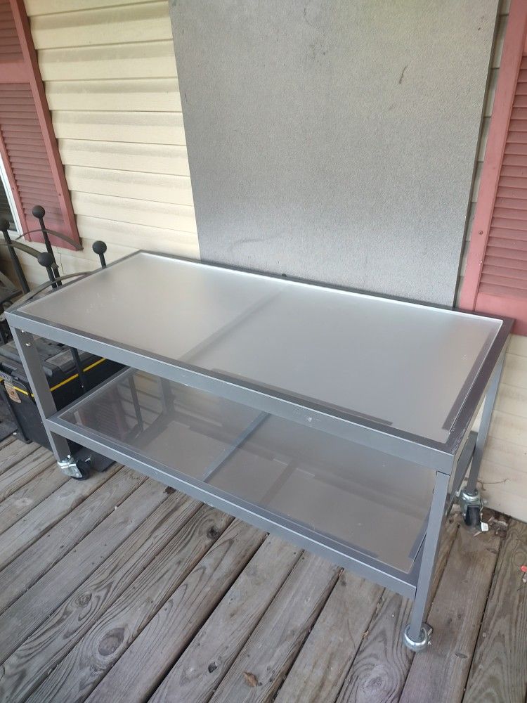 Metal Table w casters. 54"x23.5"x28.75". VG Condition.