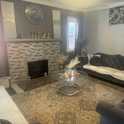 $900  3 couch set with 3 glass unbreakable tables set with 6 long curtains, 2 long Bebe wall    paintings, a flower painting,, 