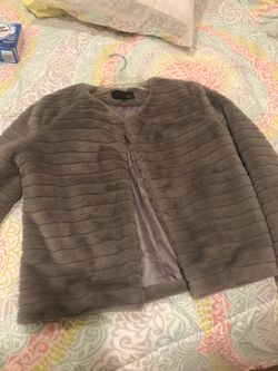 Grey small jacket used for a couple of hours