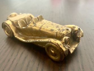 Antique brass car figurine