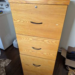 Wood filing cabinet. Lock broken , 4 1/2’ x 16 1/2” x 19 1/2”