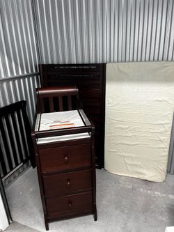 Crib with diaper change station