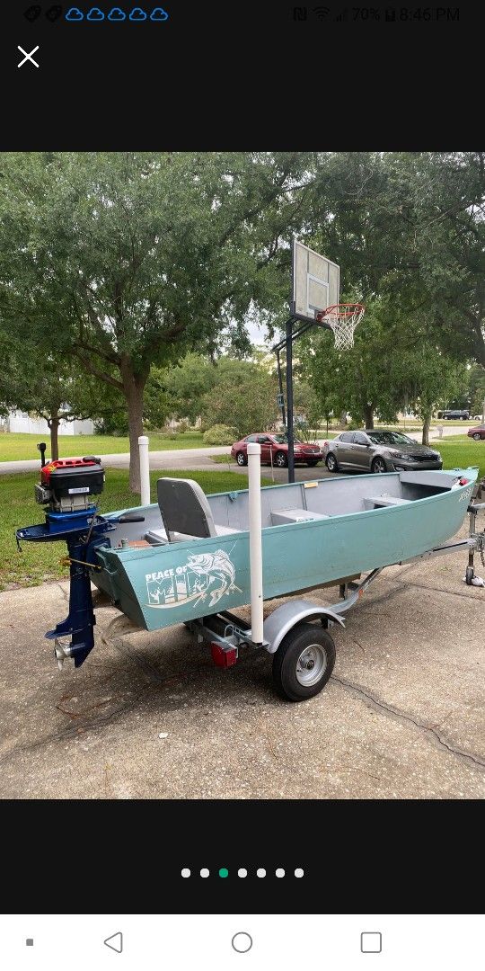 Boat With Trailer And Motor.