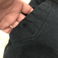 Black low rise flare jeans with button fly