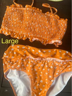 Orange Floral Bikini set with ruffled bottom and matching top. Size Large