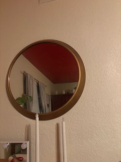 Round gold mirror
