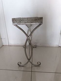 Side table mirrored glass top H 20" W 17" D 9.5". Color silver.