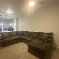 Dark grey big sectional sofa in excellent shape. Gently used, clean, and comfy. Pickup in Downtown Orlando