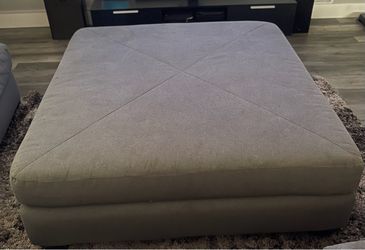 Living spaces grey ottoman
