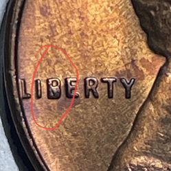 1957-D Lincoln Penny - Extra metal (error on the letter( B )