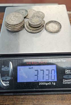 3.73 Troy ounces of  Silver World Coins !