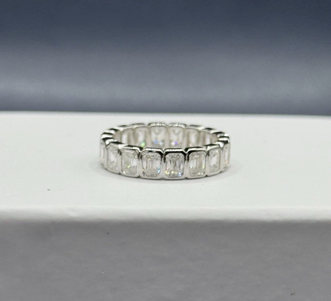 5.4cttw moissanite emerald cut bezel eternity band size 7