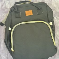 Diaper backpack with included changing pad