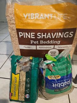 Bag of rabbit food & pet bedding