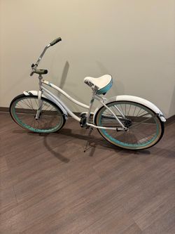 White Huffy beach cruiser. Needs inner tube for front tire. $100