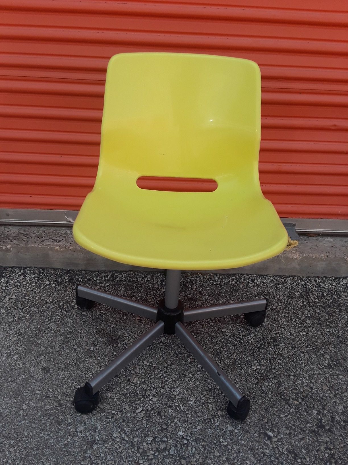 Yellow IKEA Snille office chair with wheels