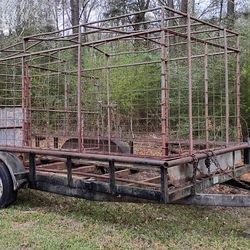 18 ft. Dual axle trailer with slide off cattle cage.