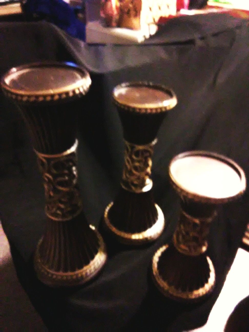 dark brown and gold Roman pillar type candle holders