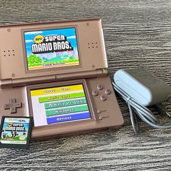 Metallic Gold Nintendo DS in excellent condition with Mario game, complete with stylus & charger $65