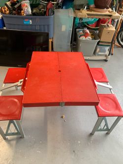 Portable camping table with seating