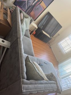 Gray studded couch