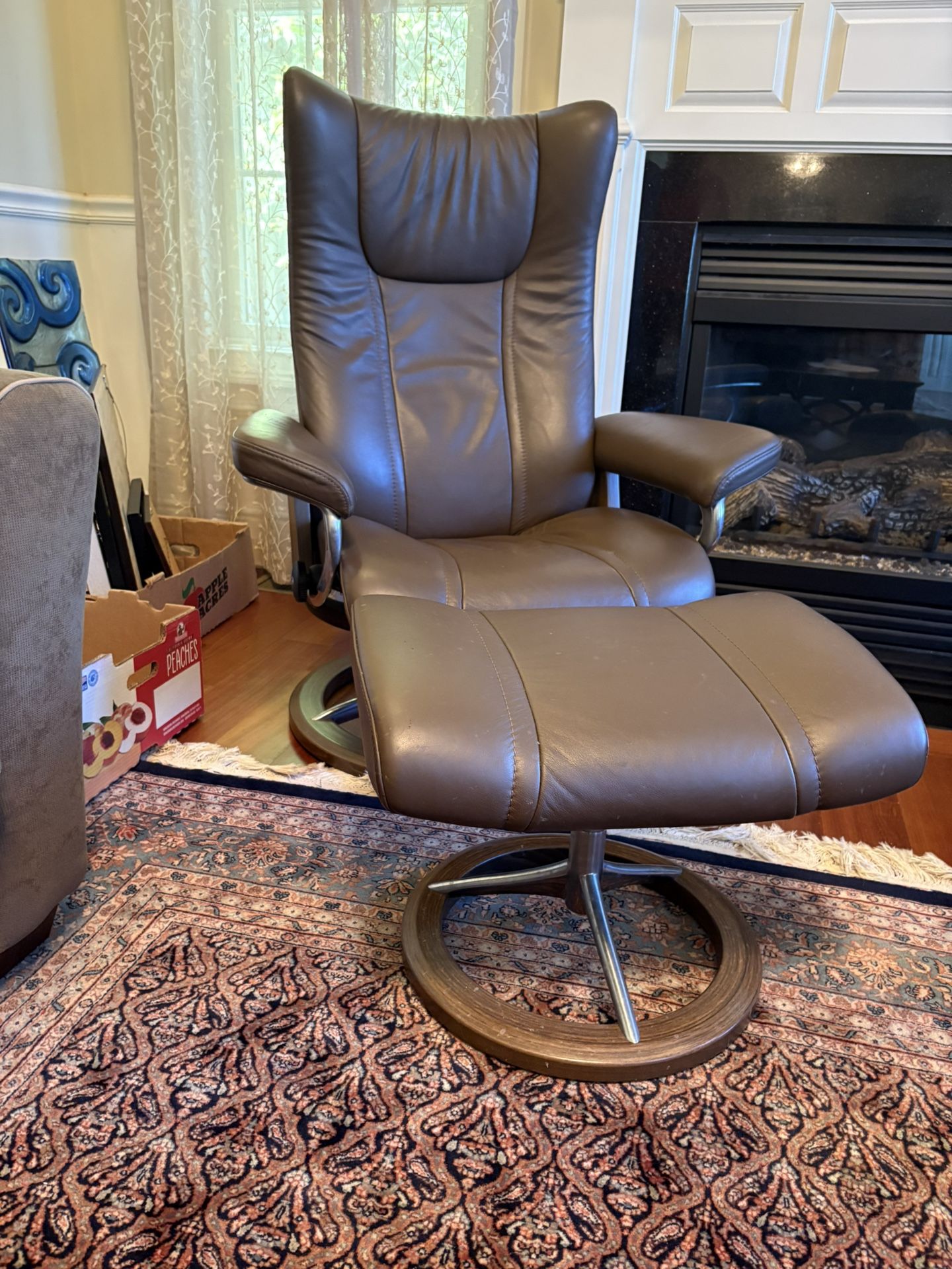 Wing Ekornes Stressless recliner with signature base, medium size, in brown Paloma leather.  