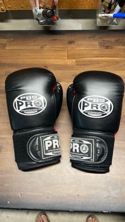 Pro Boxing Supply boxing gloves with Velcro strap.