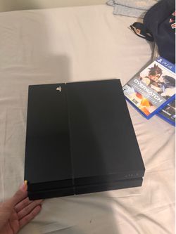 Playstation 4 with controller and 2 discs
