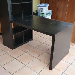 Ikea bookcase and workstation in brown/black.   Librero con estation de trabajo de Ikea.