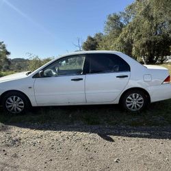 2002 Misibishi Lancer ..