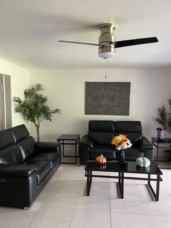 Leather head and leg recliner sofa with tables included in great condition $1,000