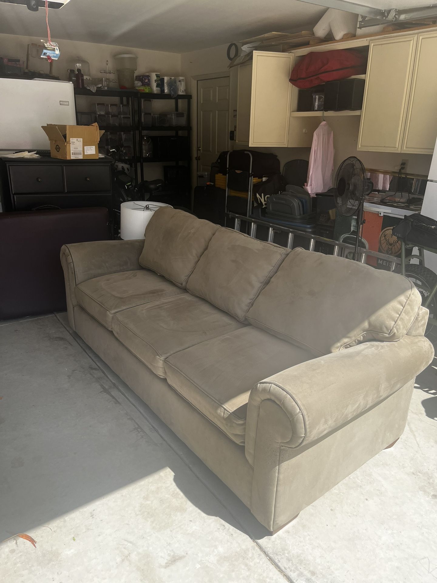 Beige Sofa With A Pull Out Bed
