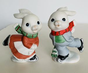 Vintage Homco christmas Ice skating Bunnies set of two. Porcelain/ceramic bisque. No chips cracks or damage. Paint Colors are bright. 4” tall.  