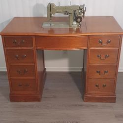 Sewing machine with a desk.