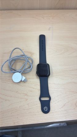 Locked Apple Watch A2723 with charger