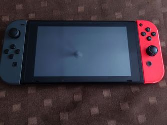 Nintendo Switch with Gray and Red Joy-Cons , Console Only , with official Nintendo Switch Charger (Read Description)