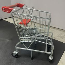 Melissa and Doug play shopping cart