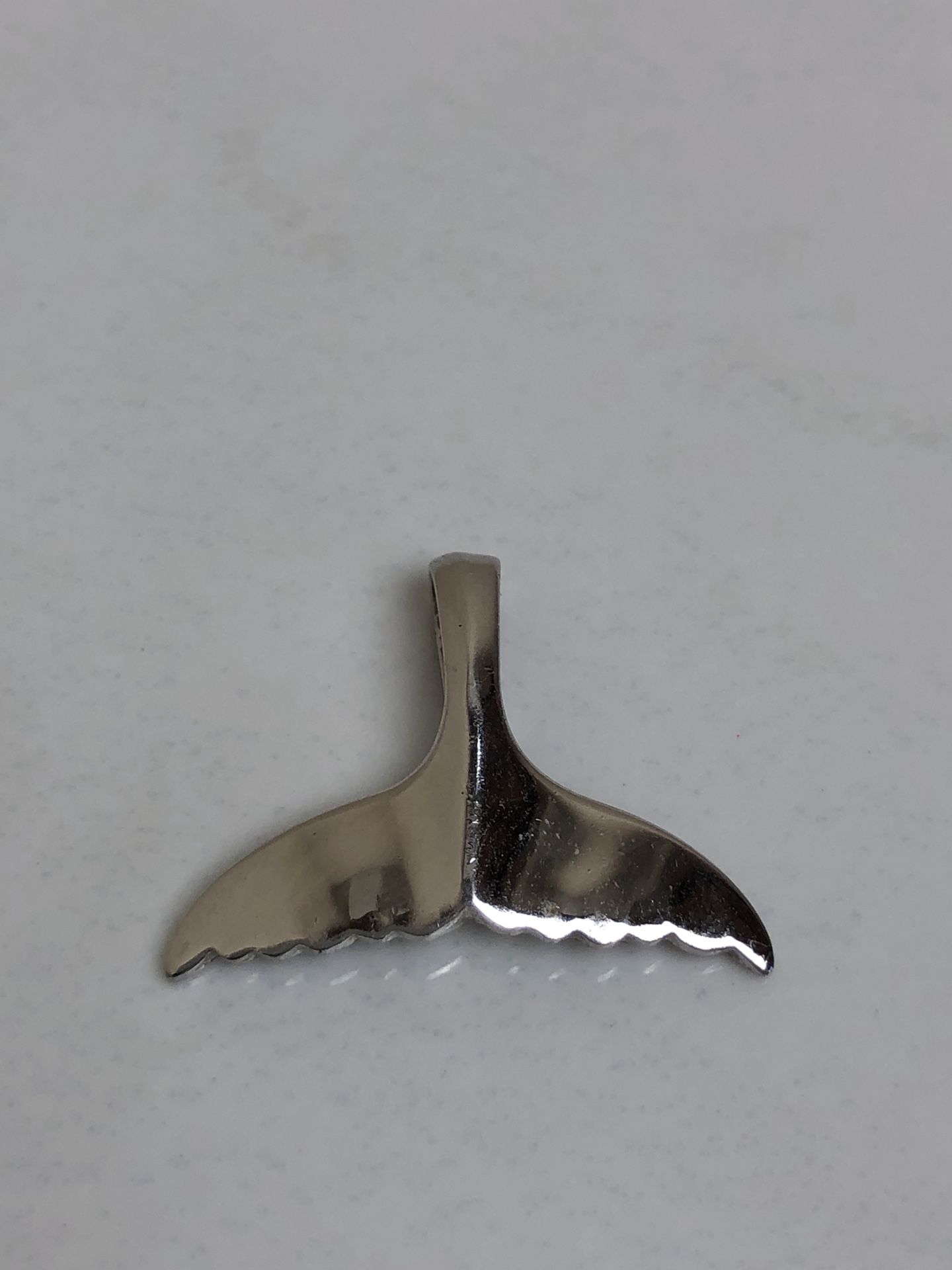 Sterling silver dolphin fin charm
