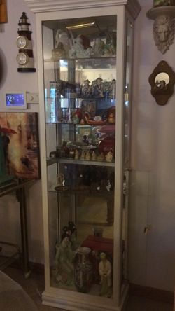 White Lighted Curio Cabinet. 76" Tall, 24" Wide, 11" Deep. $500 New. $225. Mirrored Back. NICE CHRISTMAS GIFT