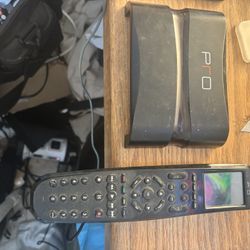Pro Control Pro24.r or Pro24.z universal remote control and its charging dock. 