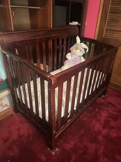 Brown wood crib