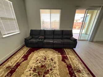Grey Reclining Sofa with Console and Cup Holders