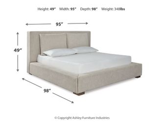 Ashley Furniture Langford King Upholstered Bed and Pillows, includes mattress, nightstands, and lamps.