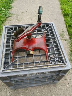 Vintage cast iron lawn sprinkler, brass tips.