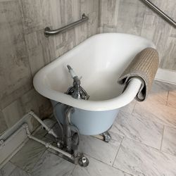 Vintage Clawfoot Cast-Iron Bathtub With Fixtures