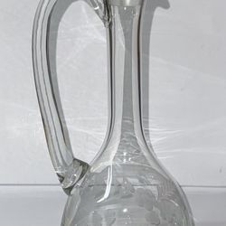 This vintage hand-blown Tuscany decanter is a tall and elegant piece with a beautiful floral frosted etching on the glass.